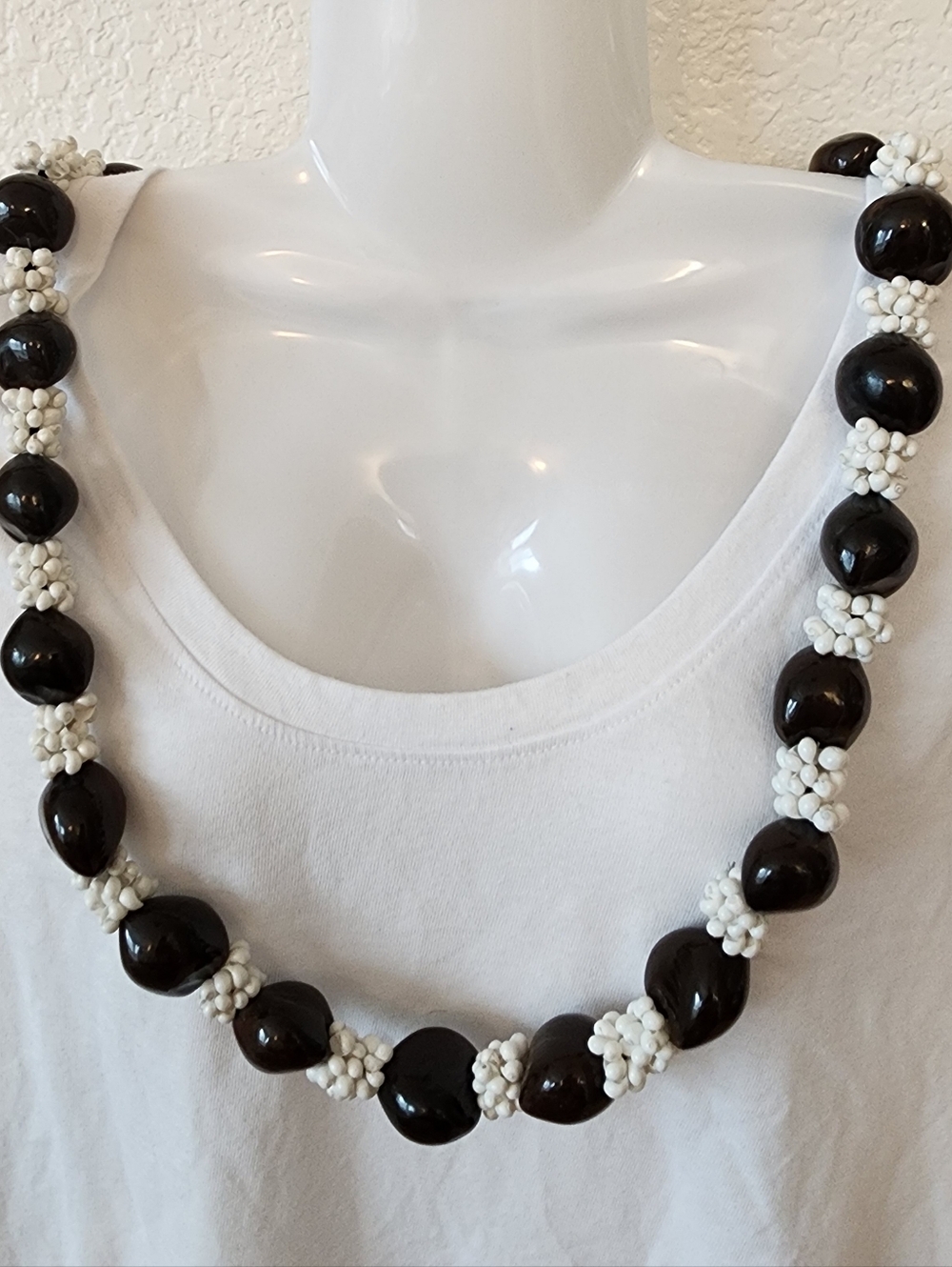 Hawaiian Kukui Nut Lei With White Tiny Sea Shells.